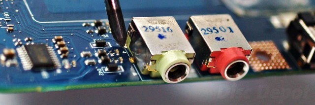 Closeup 3:1 crop of laptop audio jack repair